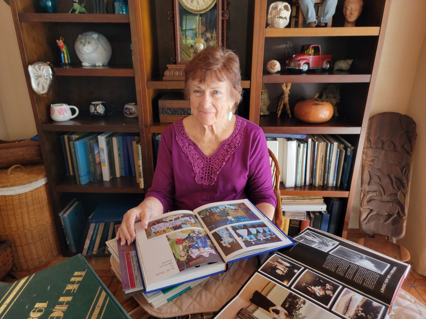 Toni Bell Rescoe with yearbooks she’s saved for decades
