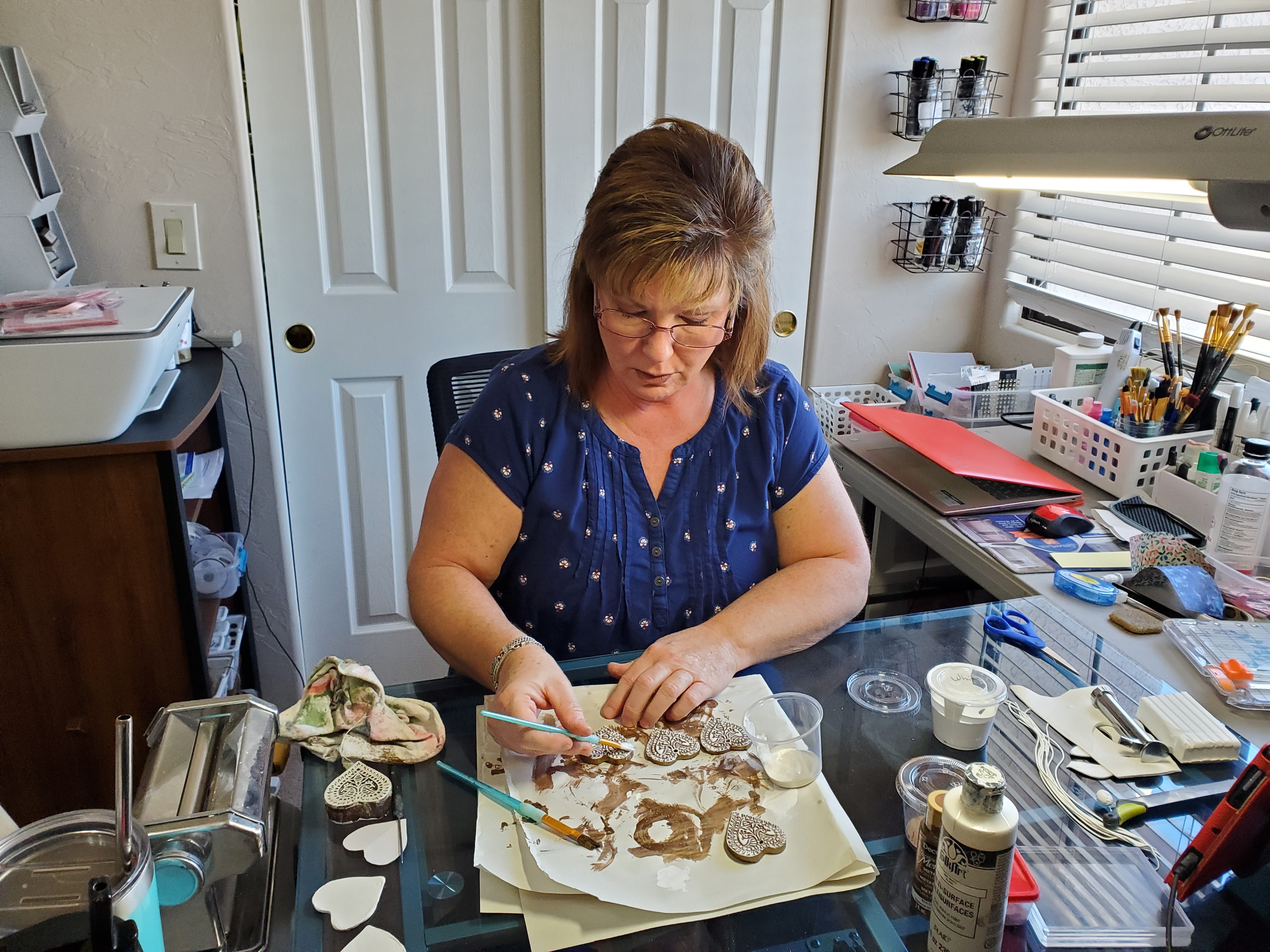 Artist Rhonda Smith crafts hearts in her workshop